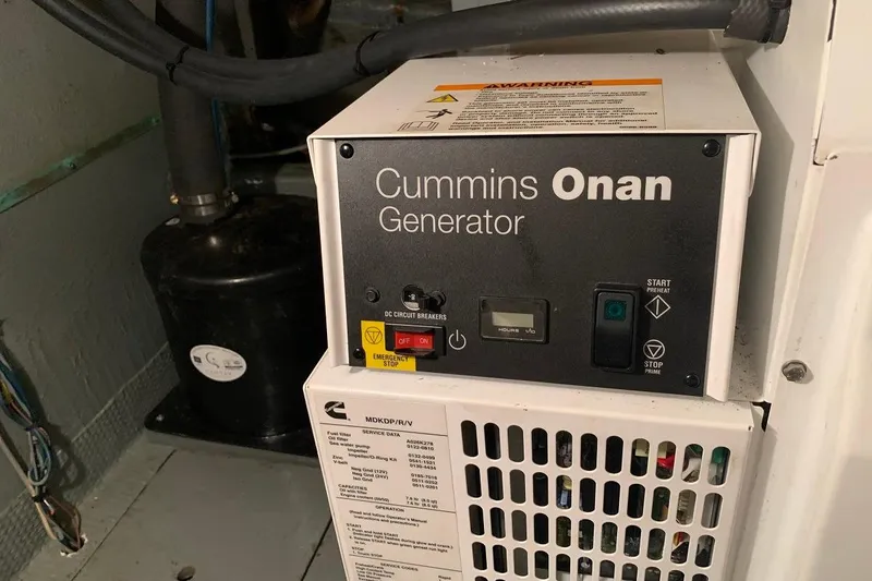 Slide: The Image of Cummins Onan generator in a 1978 Hatteras 53 Motor Yacht engine room. - 75