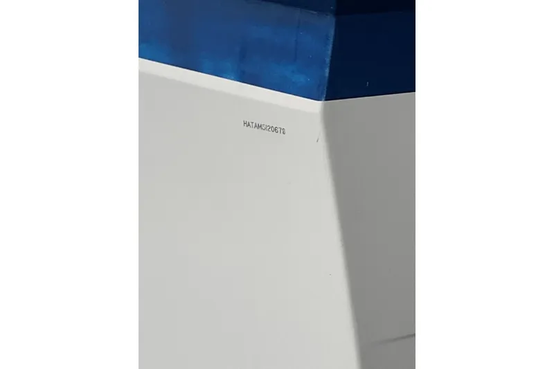 Slide: The Image of Close-up of 1978 Hatteras 53 Motor Yacht hull with blue and white paint. - 77