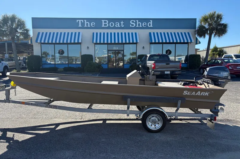 The Image of 2026 SeaArk 1648 MV boat on trailer outside The Boat Shed dealership. - 0