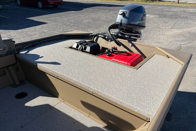 Slide: The Image of 2026 SeaArk 1648 MV boat interior with motor and fuel tank. - 8