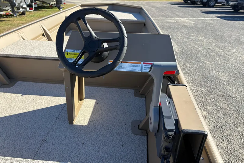 Slide: The Image of 2026 SeaArk 1648 MV boat interior with steering wheel and control panel. - 9