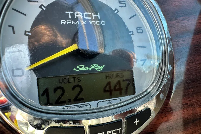 Slide: The Image of Tachometer of 2011 Sea Ray 240 Sundeck showing 12.2 volts and 447 hours. - 14