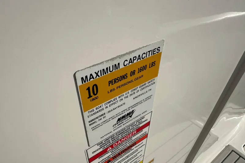 Slide: The Image of 2011 Sea Ray 240 Sundeck capacity label, maximum 10 persons or 1600 lbs. - 15