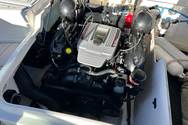 Slide: The Image of Engine compartment of a 2011 Sea Ray 240 Sundeck boat. - 16