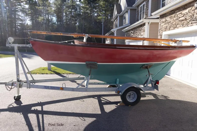 Slide: The Image of Red and teal Herreshoff 12 sailboat on trailer, Cape Cod Shipbuilding, 2002 model. - 4