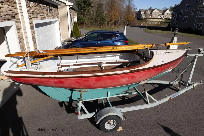 Slide: The Image of Herreshoff 12 sailboat on trailer, Cape Cod Shipbuilding, 2002 model, parked in residential area. - 6