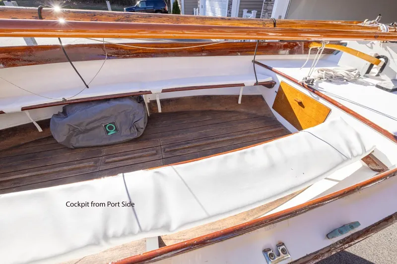 Slide: The Image of Cockpit view of 2002 Cape Cod Shipbuilding Herreshoff 12 sailboat, showcasing wooden details. - 7