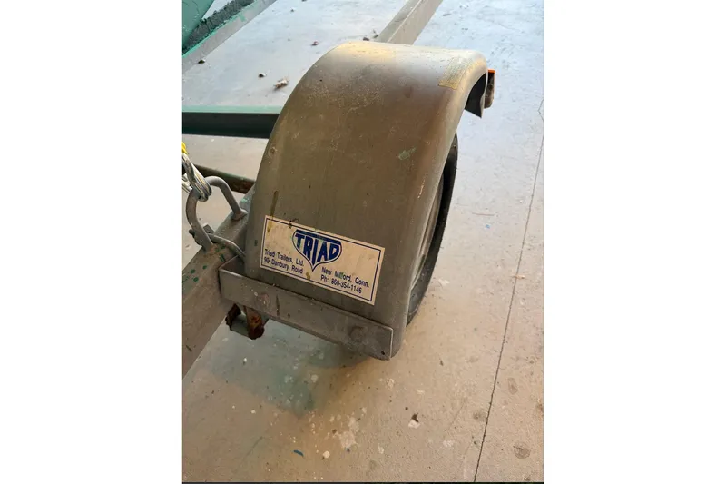 Slide: The Image of Trailer fender with Triad Trailers label, suitable for Herreshoff 12 1/2, 2002 model. - 9