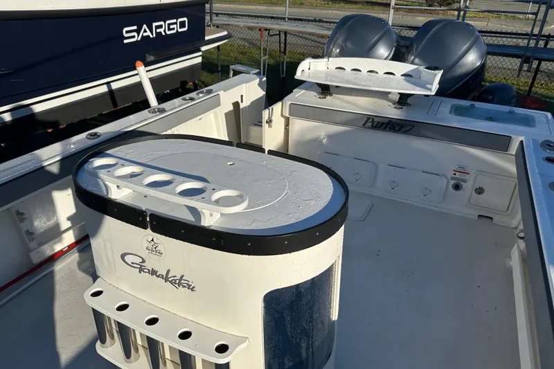 Slide: The Image of 2019 Parker 2820 XLD Sport Cabin boat interior with fishing rod holders. - 19