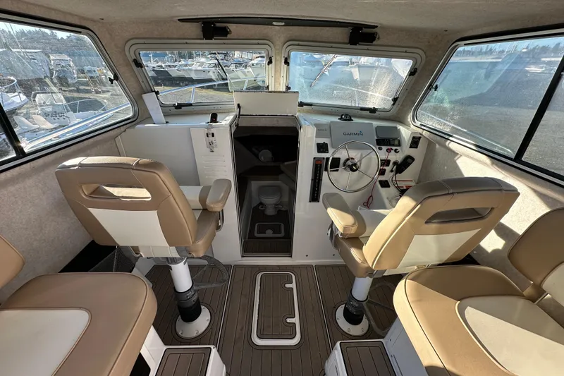 Slide: The Image of Interior of 2019 Parker 2820 XLD Sport Cabin with helm and seating. - 20