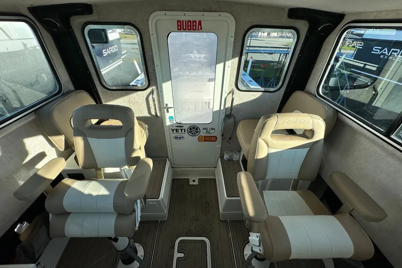Slide: The Image of 2019 Parker 2820 XLD Sport Cabin interior with beige seating and windows. - 22