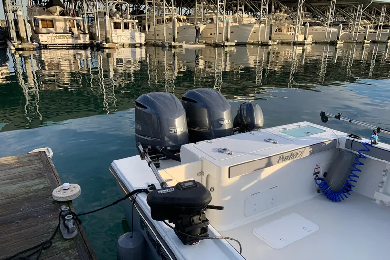 Slide: The Image of 2019 Parker 2820 XLD Sport Cabin boat docked with twin Yamaha 300 engines. - 5
