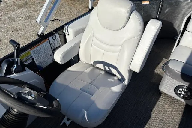 Slide: The Image of Captain's chair in 2022 Sweetwater 2286 boat, featuring plush white upholstery and ergonomic design. - 14