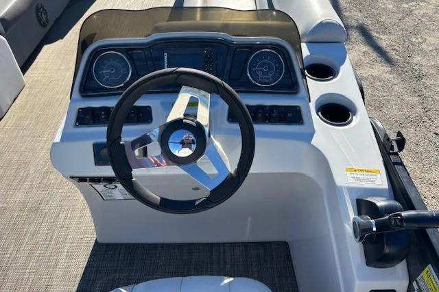 Slide: The Image of Steering console of 2022 Sweetwater 2286 boat with modern controls and gauges. - 15
