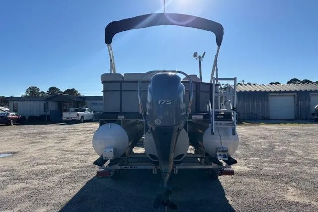 Slide: The Image of 2022 Sweetwater 2286 pontoon boat with 175 HP engine, parked outdoors. - 3