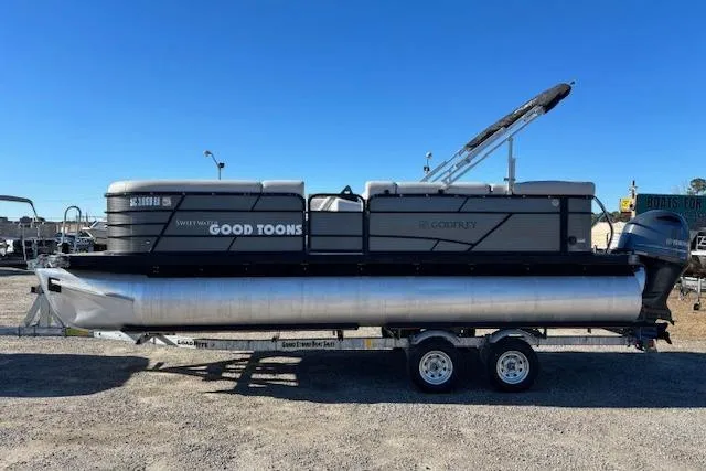 Slide: The Image of 2022 Sweetwater 2286 pontoon boat on trailer under clear blue sky. - 5