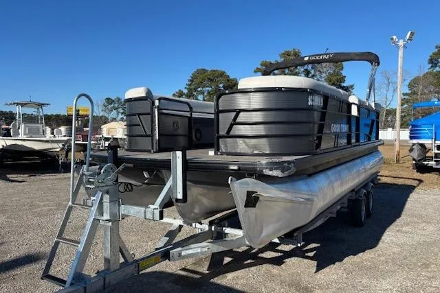 Slide: The Image of 2022 Sweetwater 2286 pontoon boat on trailer in outdoor lot. - 6