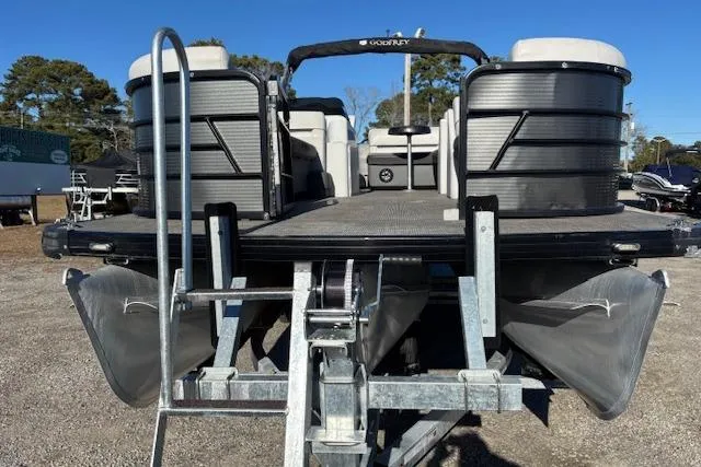 Slide: The Image of 2022 Sweetwater 2286 pontoon boat on trailer, rear view, outdoors. - 7