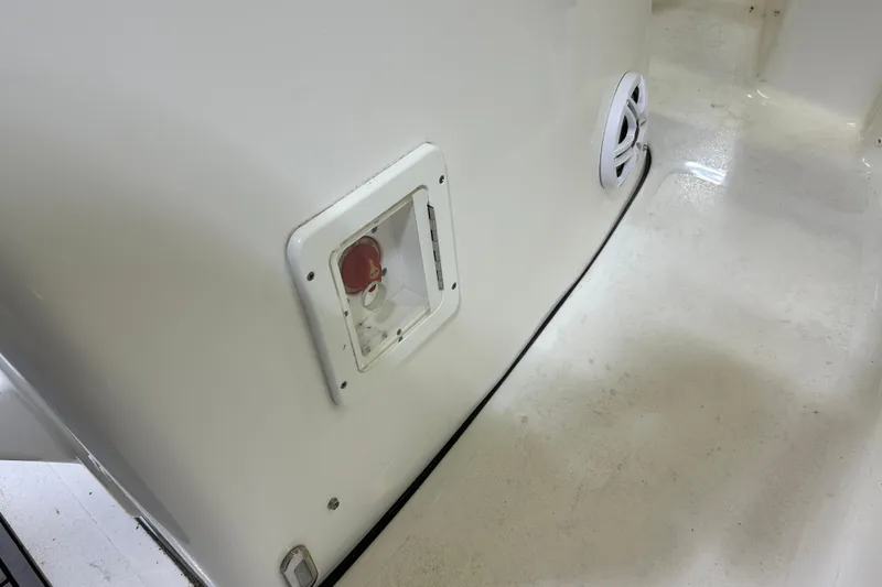 Slide: The Image of 2024 Tidewater 198 CC Adventure boat interior detail with control panel and speaker. - 17