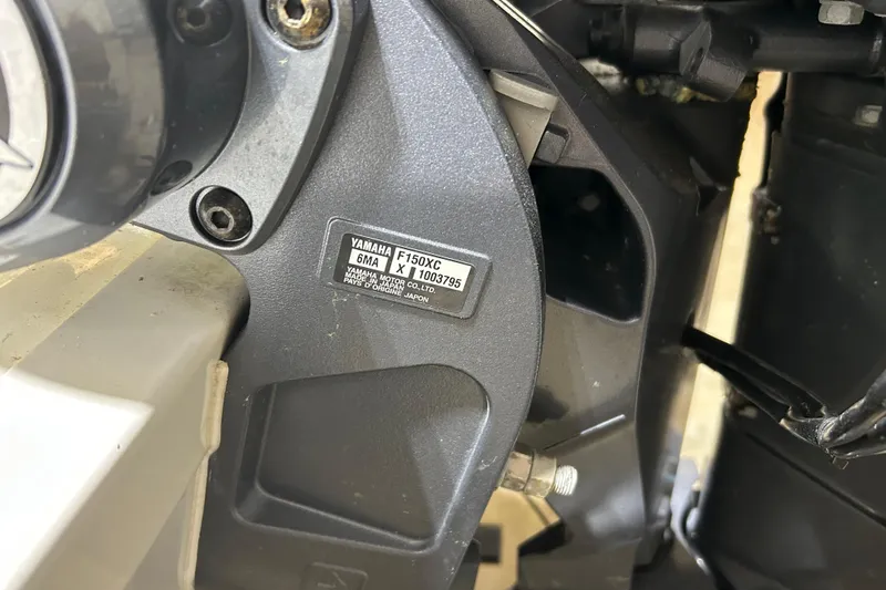 Slide: The Image of Close-up of Yamaha F150XC engine on 2024 Tidewater 198 CC Adventure boat. - 27