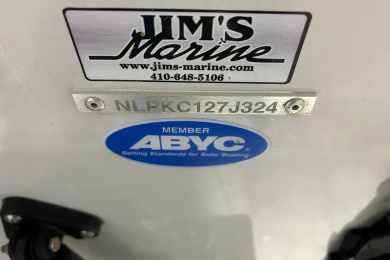 Slide: The Image of 2024 Tidewater 198 CC Adventure boat with Jim's Marine and ABYC member stickers. - 28