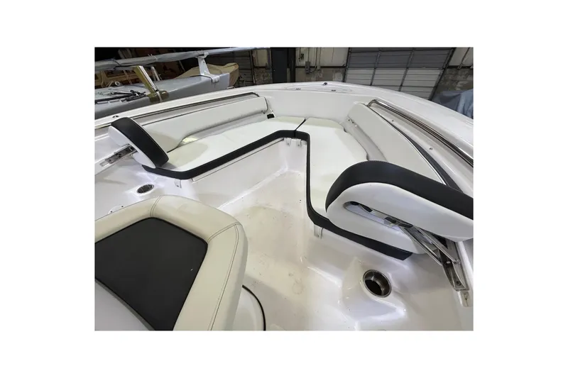 Slide: The Image of 2024 Tidewater 198 CC Adventure boat interior with cushioned seating and sleek design. - 6