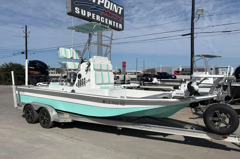 Slide: The Image of 2020 Shallow Sport 24 Sport boat deck with open storage compartment. - 11