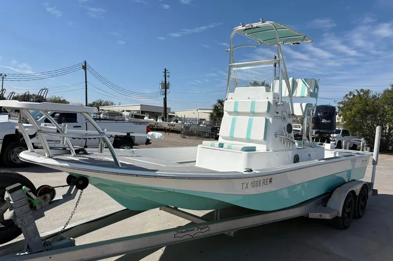 Slide: The Image of 2020 Shallow Sport 24 Sport boat deck with seating and equipment, viewed from above. - 13
