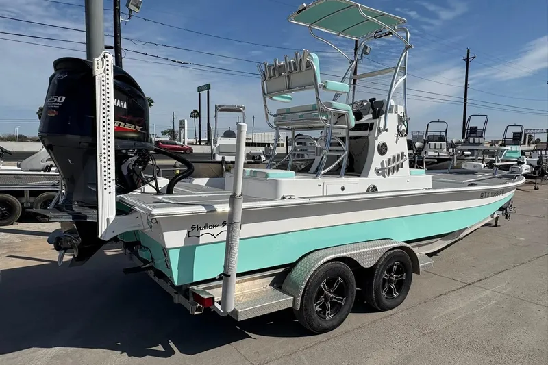 Slide: The Image of 2020 Shallow Sport 24 Sport boat with striped seating and modern design. - 15