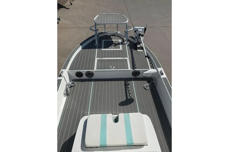 Slide: The Image of 2020 Shallow Sport 24 Sport boat on trailer under clear blue sky. - 5