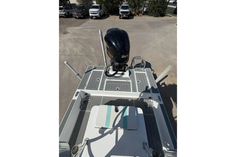 Slide: The Image of 2020 Shallow Sport 24 Sport boat console with steering wheel and navigation equipment. - 8