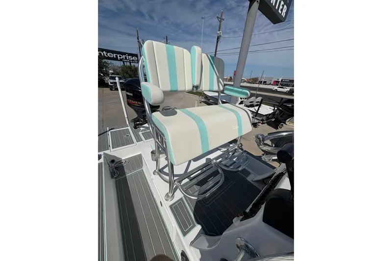 Slide: The Image of 2020 Shallow Sport 24 Sport boat with outboard motor in parking lot. - 9
