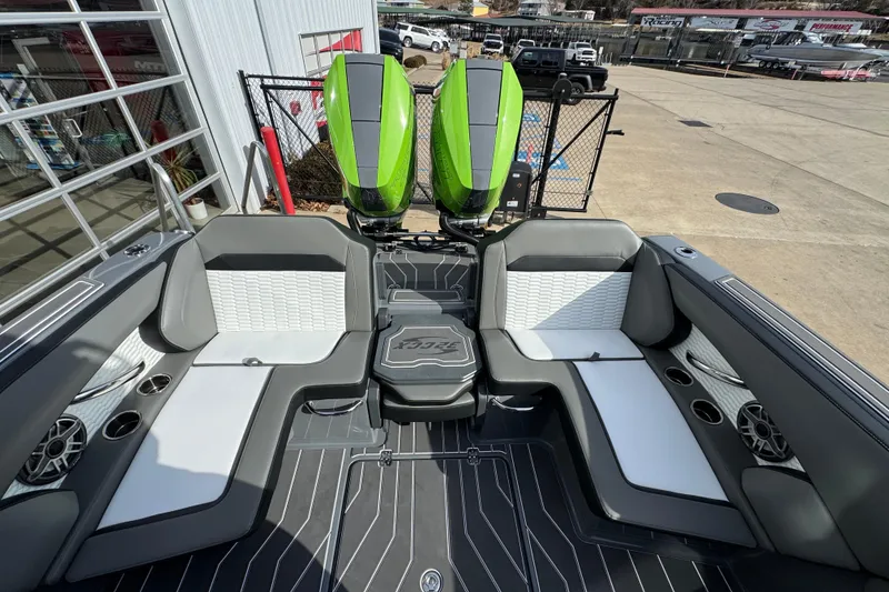 Slide: The Image of 2026 Sunsation 32 CCX boat interior with modern seating and dual green engines. - 10