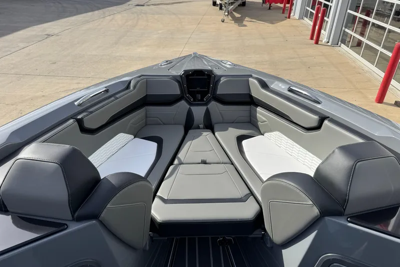 Slide: The Image of 2026 Sunsation 32 CCX boat interior with sleek gray and white seating design. - 19