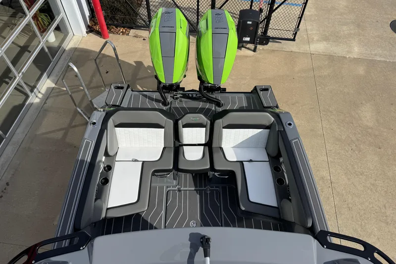 Slide: The Image of 2026 Sunsation 32 CCX boat with dual green outboard motors and sleek seating. - 22