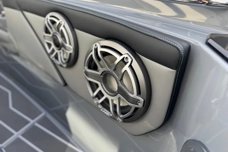 Slide: The Image of 2026 Sunsation 32 CCX boat interior with sleek speaker design and modern upholstery. - 25