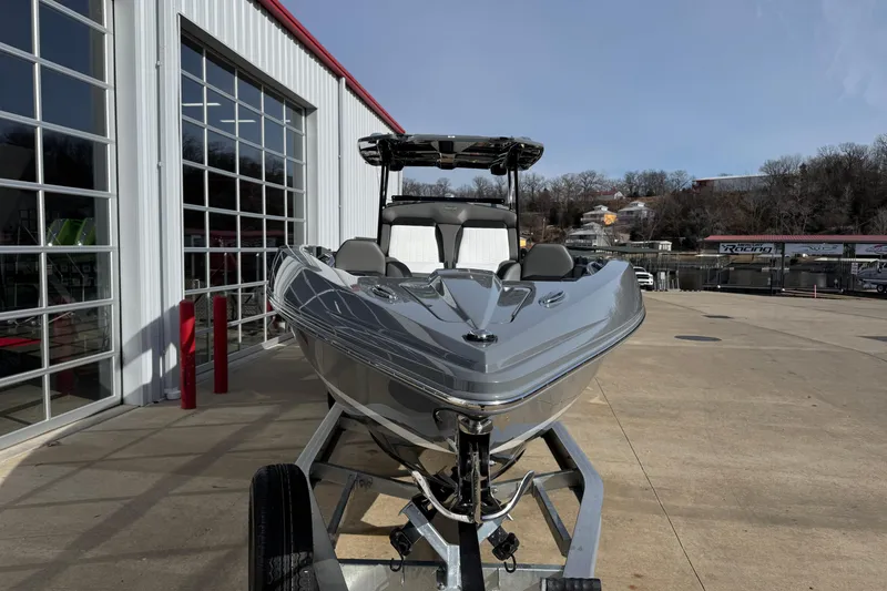 Slide: The Image of 2026 Sunsation 32 CCX boat on trailer outside a modern building. - 31