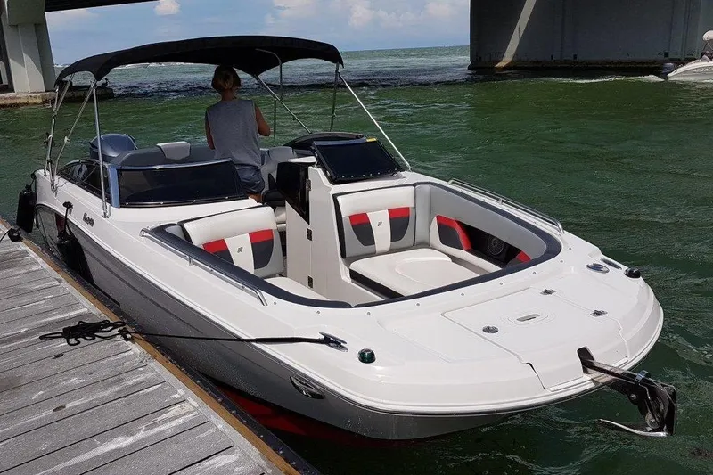 The Image of 2018 Four Winns HD240 OB boat on calm water under cloudy sky. - 0