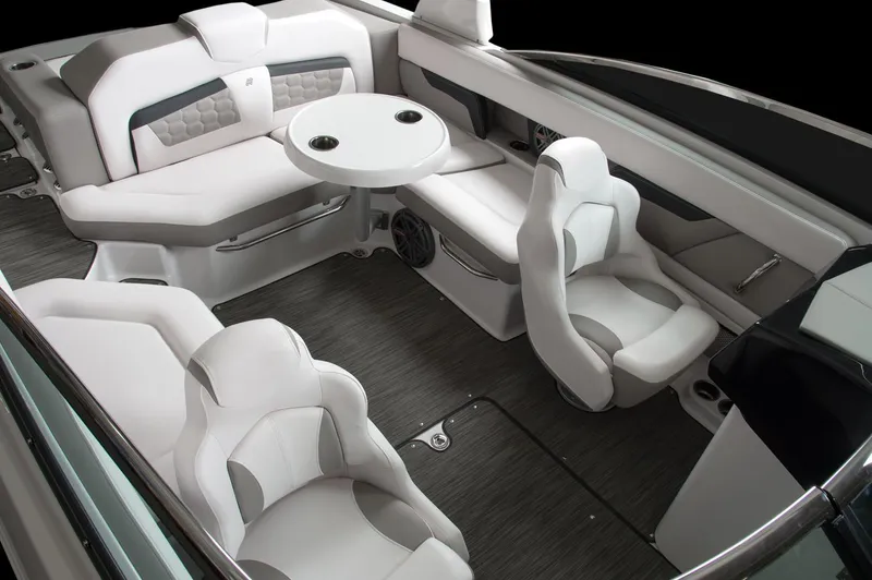 Slide: The Image of Manufacturer Provided Image: 2018 Four Winns HD240 OB boat interior with white seating and round table. - 15