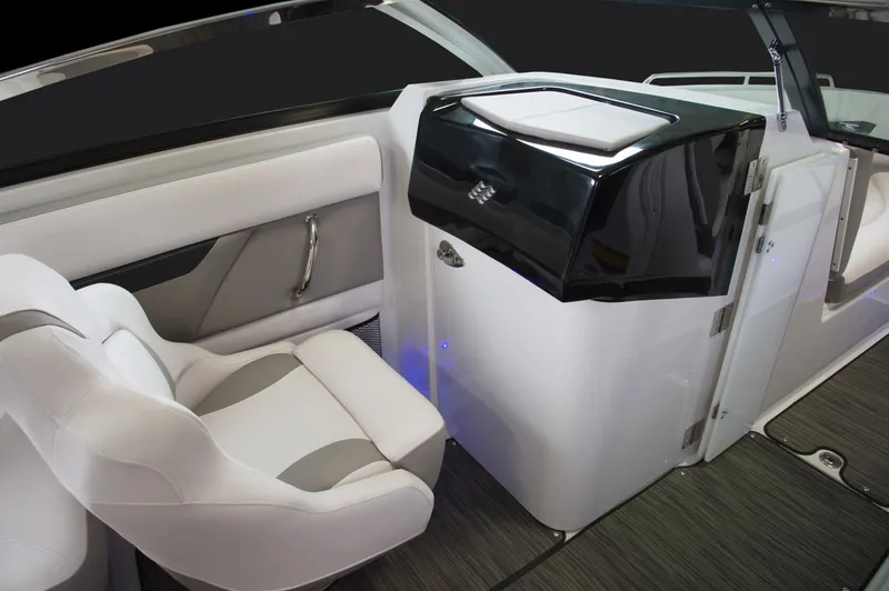 Slide: The Image of Manufacturer Provided Image: 2018 Four Winns HD240 OB boat dashboard with steering wheel, navigation system, and controls. - 17