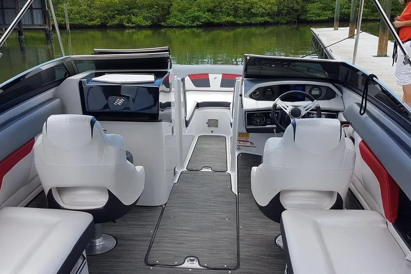 Slide: The Image of 2018 Four Winns HD240 OB boat cockpit with steering wheel and control panel. - 6