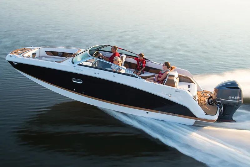 Slide: The Image of 2018 Four Winns HD240 OB boat with red and white design on water. - 8