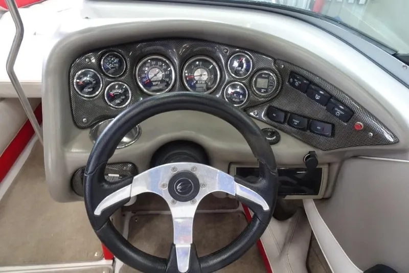 Slide: The Image of Dashboard of 2008 Crownline 23 SS boat with steering wheel and gauges. - 12