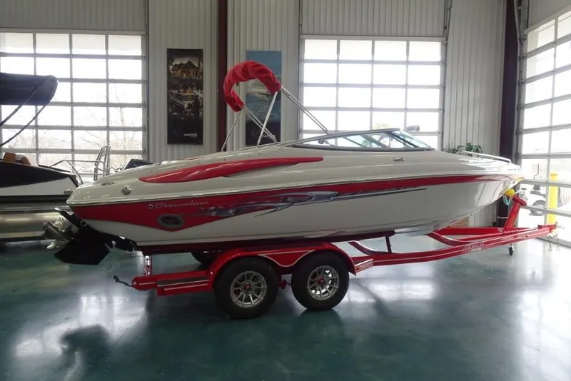 Slide: The Image of 2008 Crownline 23 SS boat on red trailer in showroom. - 4