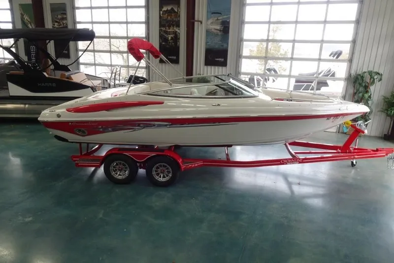 Slide: The Image of 2008 Crownline 23 SS boat on red trailer in showroom. - 5