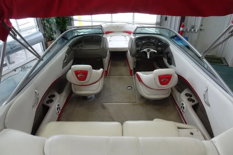 Slide: The Image of Interior of a 2008 Crownline 23 SS boat with red and white seating. - 8