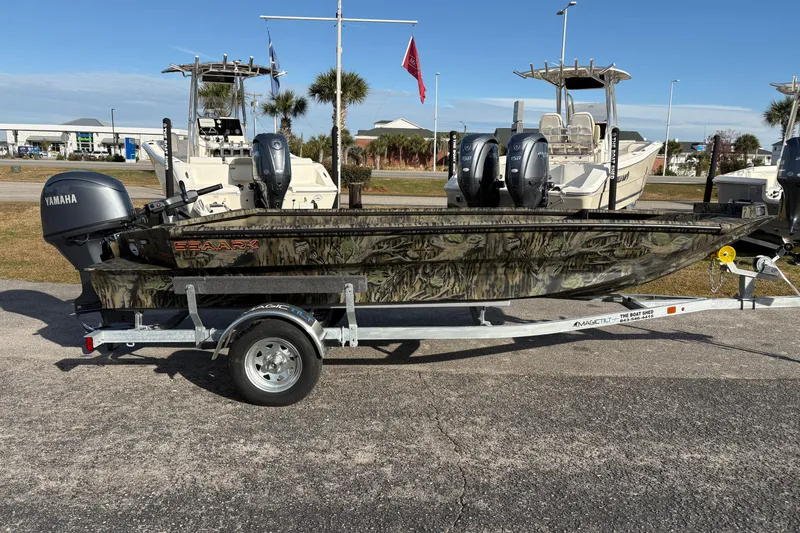 Slide: The Image of 2026 SeaArk 1752 Slayer X boat with Yamaha motor on trailer, displayed outdoors. - 5