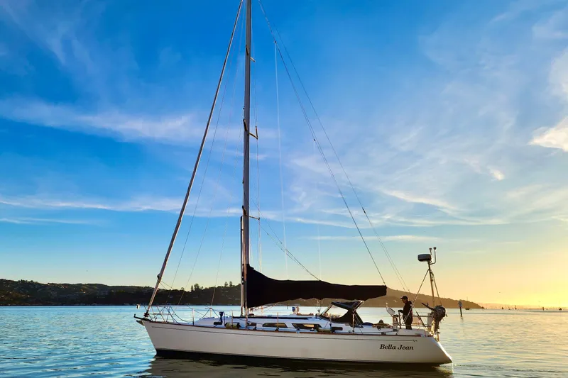The Image of Sailboat Sabre 402, 2000 model, on calm water at sunset. - 0