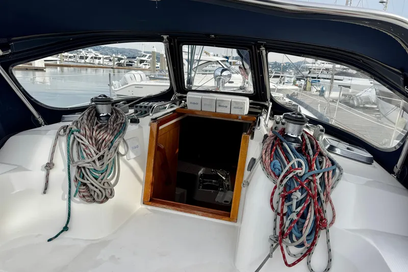 Slide: The Image of Cockpit of 2000 Sabre 402 sailboat with ropes and marina view. - 16