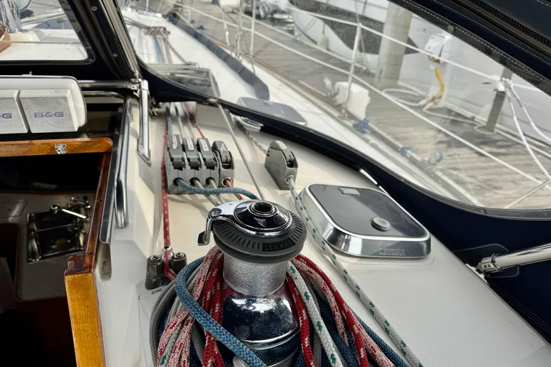 Slide: The Image of Sailboat deck of 2000 Sabre 402 with winch, ropes, and navigation equipment. - 17